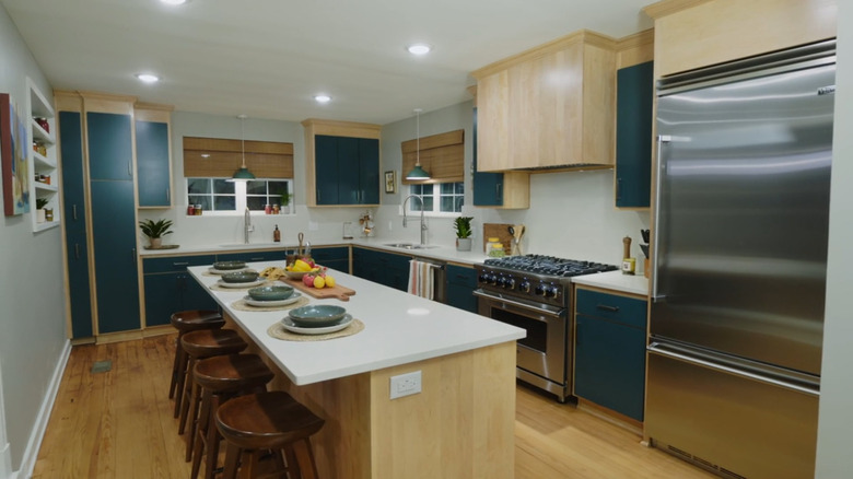 A Scandinavian kitchen with blue cabinets