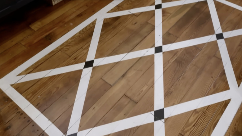 A diamond design painted on a wood floor