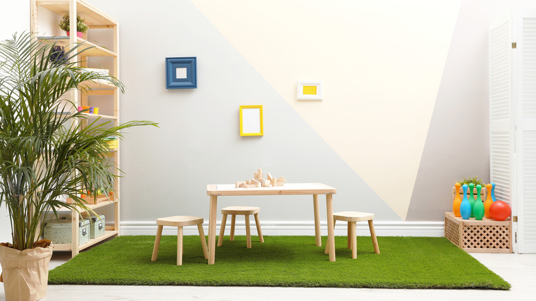 faux grass rug in child's playroom