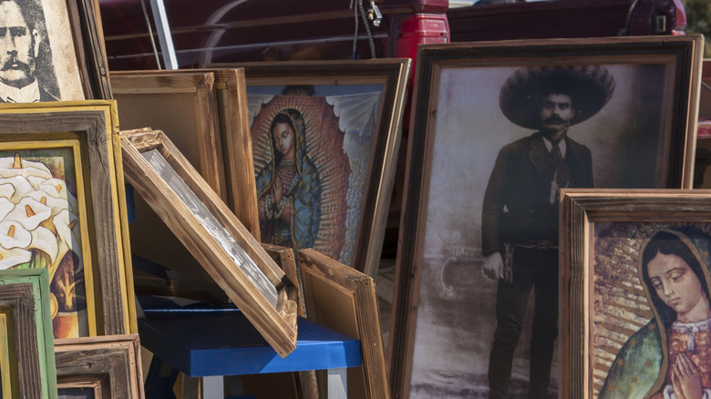 Many styles and shapes of frames for sale at a flea market