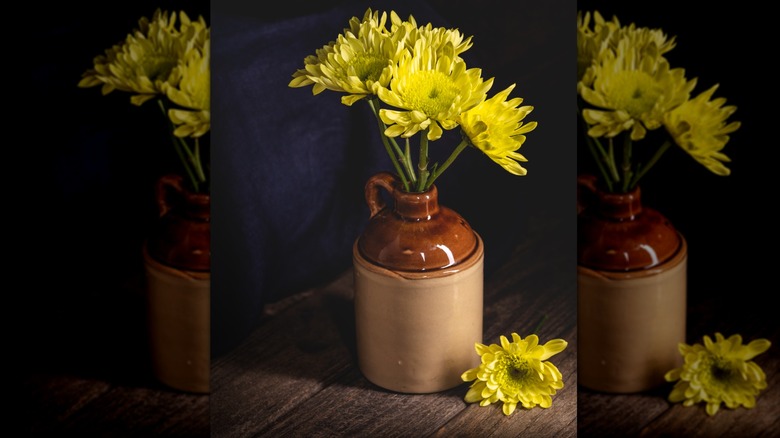 Antique stoneware jug with flowers