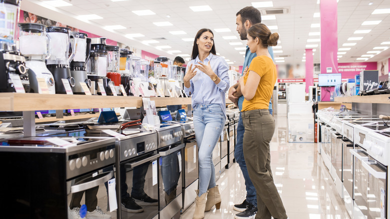 A couple shopping for new appliances
