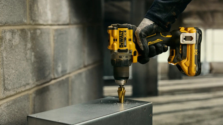 A person using DeWalt's 20V XR Lithium-Ion Brushless ½-inch Drill Driver