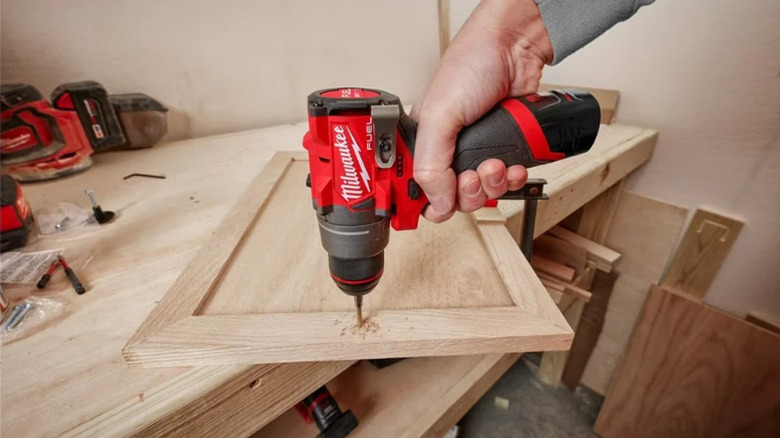 Close-up of a person using Milwaukee's M12 Fuel ½-inch Drill Driver