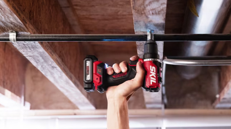 A person using Skil's ½-inch Drill Driver