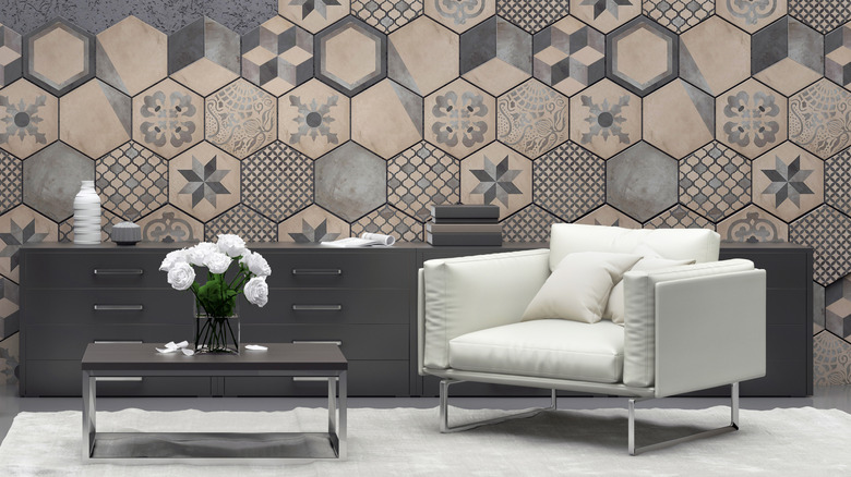 A monochrome living room with faux tile wallpaper