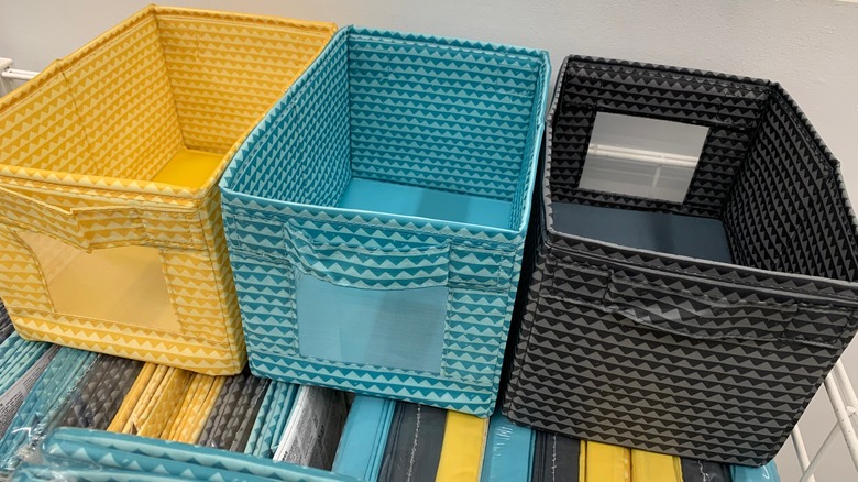 Black, blue, and yellow collapsible fabric storage bins
