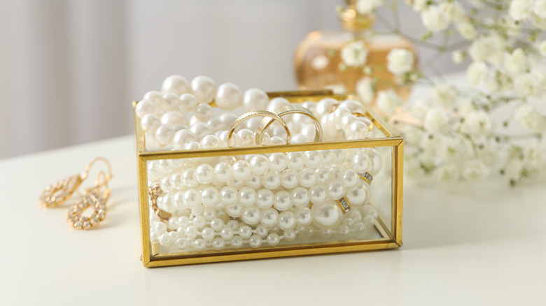 glass box with jewelry in it