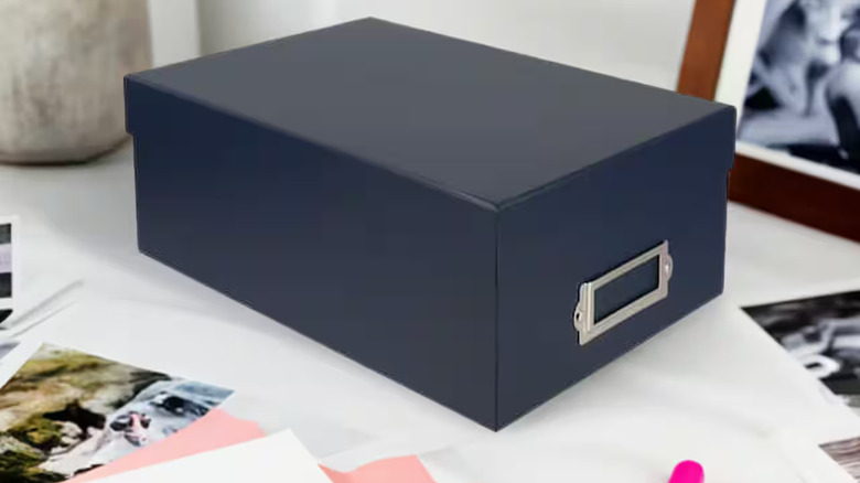 navy photo box on a desk