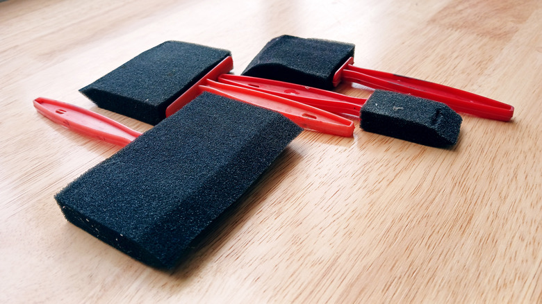 Foam-headed paintbrushes on a table