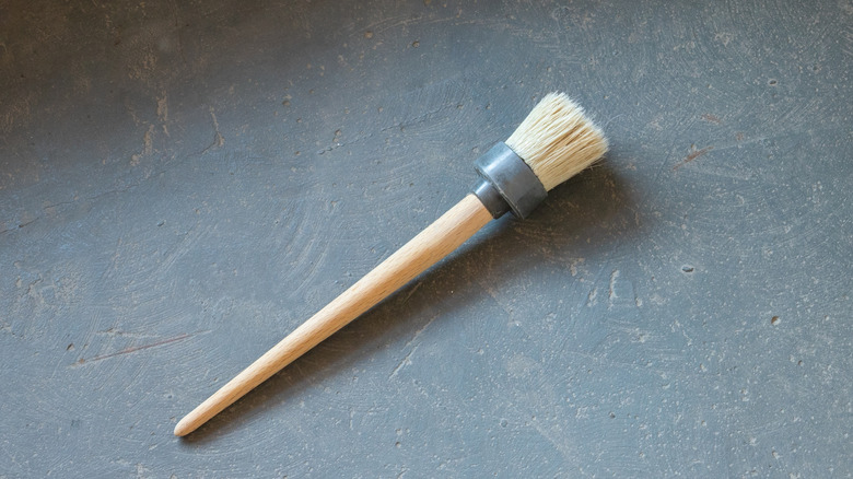 A stencil brush with its round, flattened head
