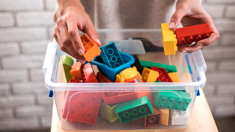 Close up of a clear box filled with plastic toys