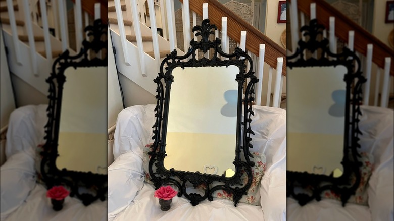 A black Chinese Chippendale Pagoda mirror.