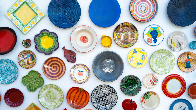 Funky decorative plates hanging on wall.
