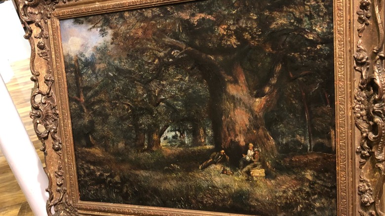 A framed landscape painting by John Constable.