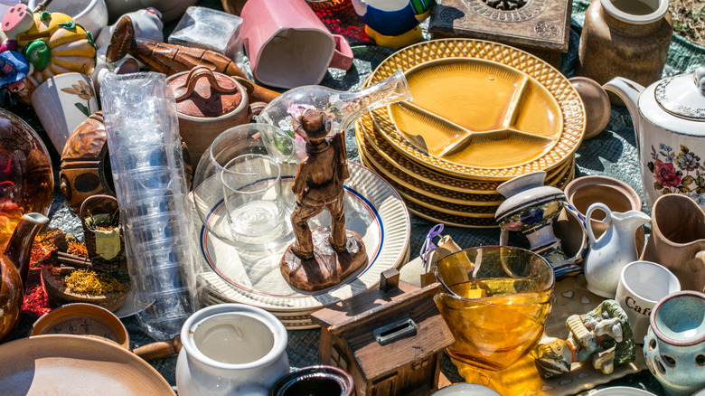 Piles of household objects laid out on a table.