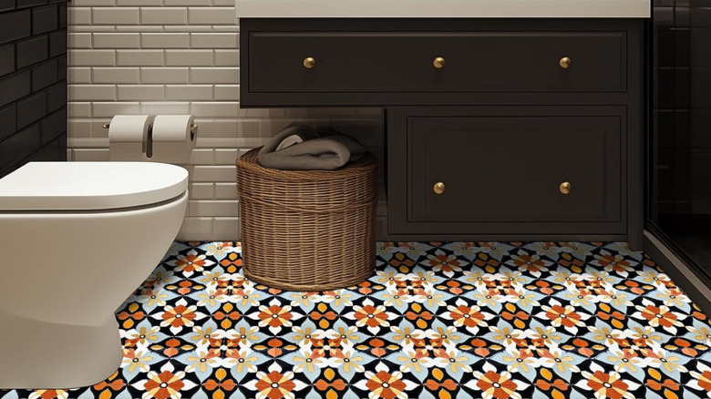 Blue and orange mosaic patterned vinyl floor.
