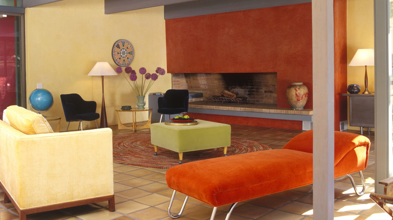 Living room with yelloe and orange walls.