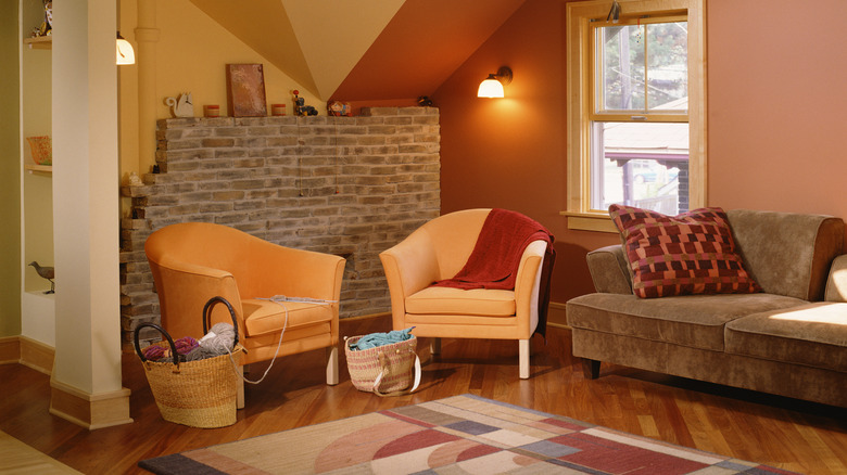 Room painted with two tone orange walls.