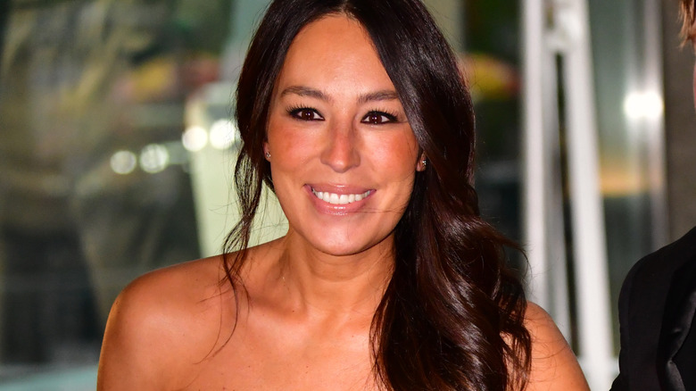Joanna Gaines poses in a strapless top