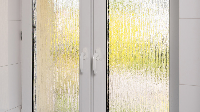 A close-up look at a reeded glass window.