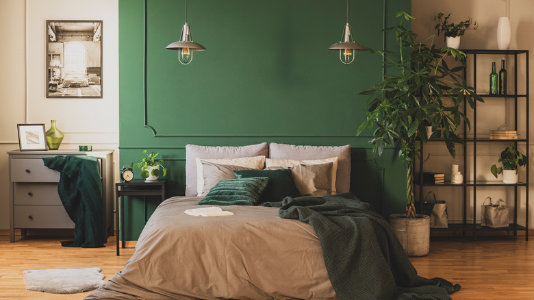 green bedroom with industrial elements