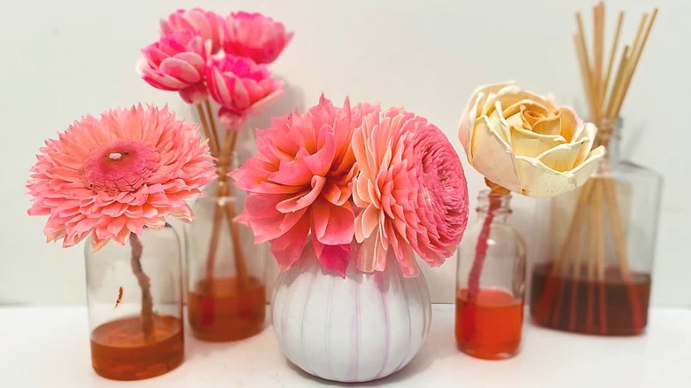 Several small vases made into reed diffusers