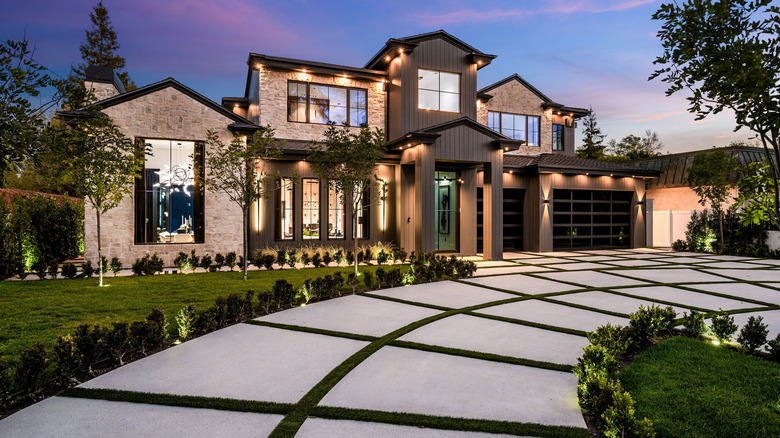 Modern luxury home with a driveway made from oversized slabs.