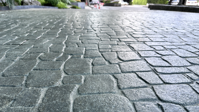 Close up of a saw cut or stamped concrete driveway.