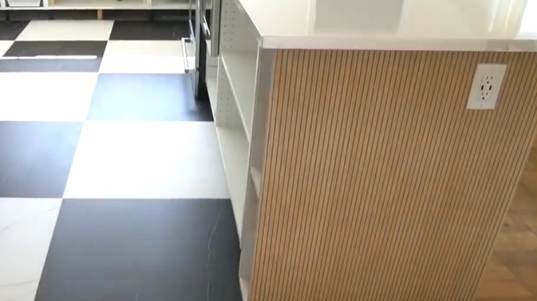 Pole wrap installed underneath the countertop on a kitchen island