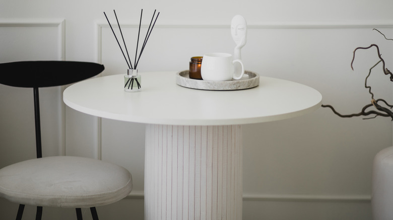 Pole wrap around table base with incense and tea