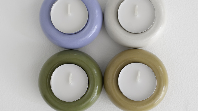 tea lights in different colored candle holders