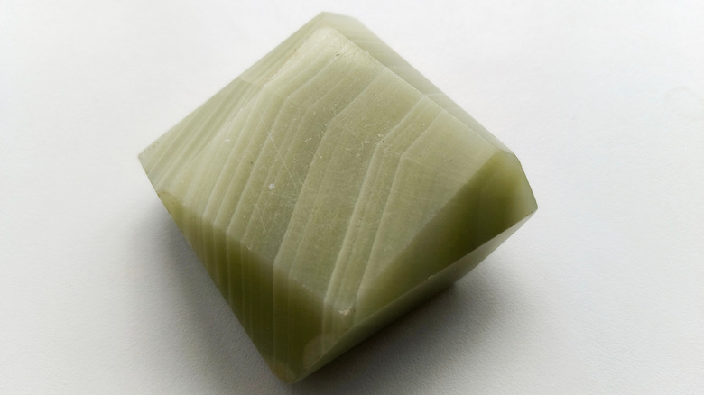 A block of striated greenish stone