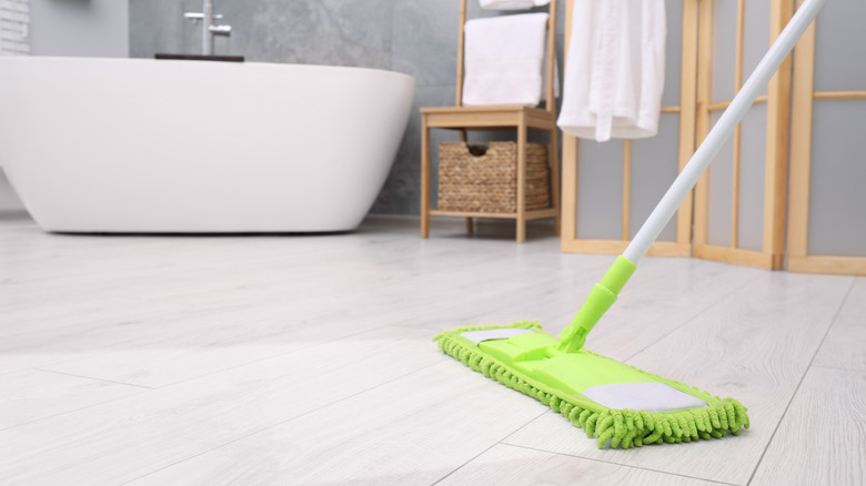 Mopping bathroom floor