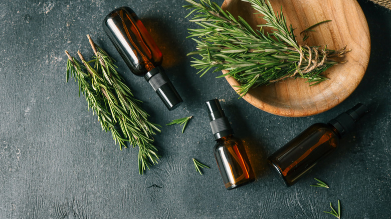 Amber glass bottles with pine boughs.
