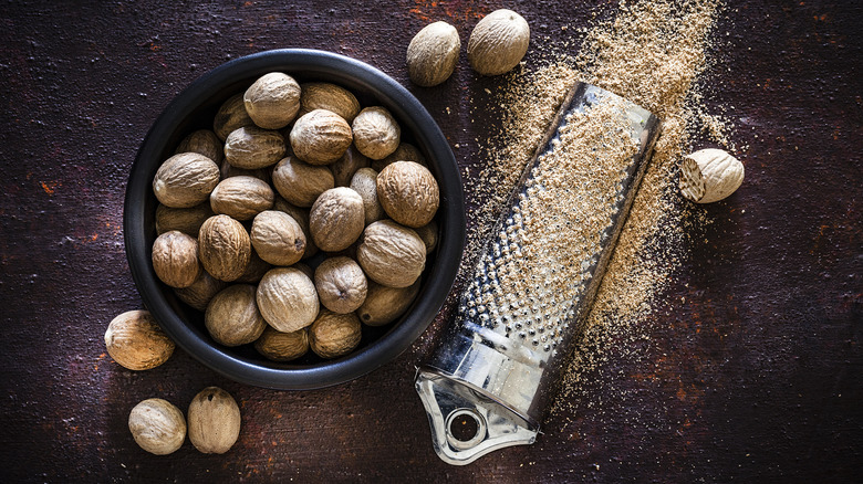 Whole nutmegs and grater.