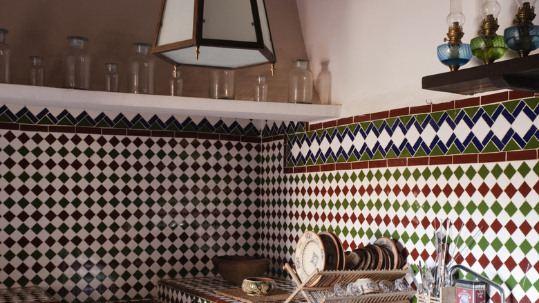 A bold geometric tiled kitchen.