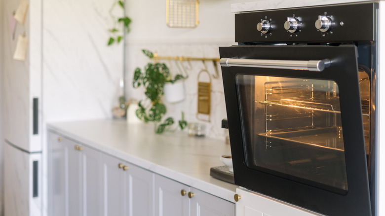 A black oven in a modern ktichen.