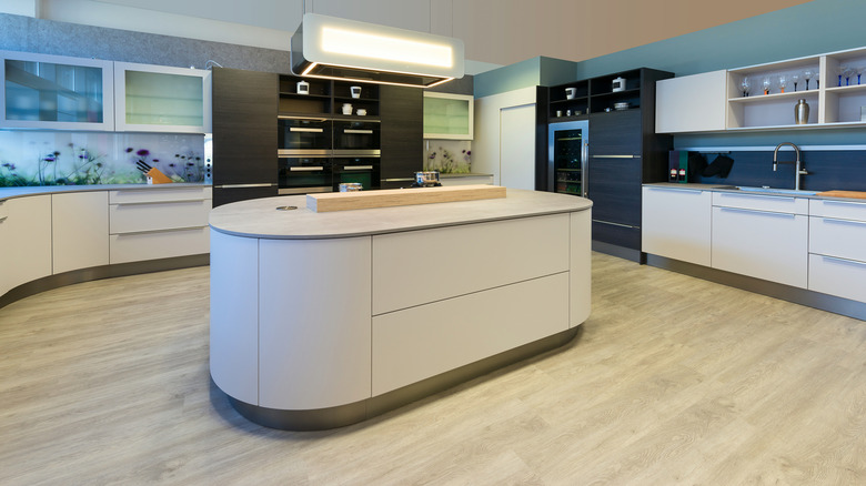 A 1980s kitchen with a rounded island.