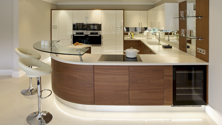 A white '80s kitchen with wood accents.