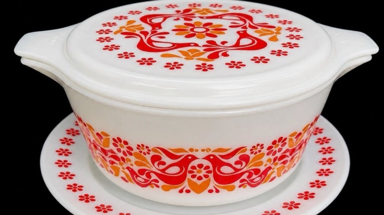 A white Pyrex Friendship casserole dish with lid and saucer