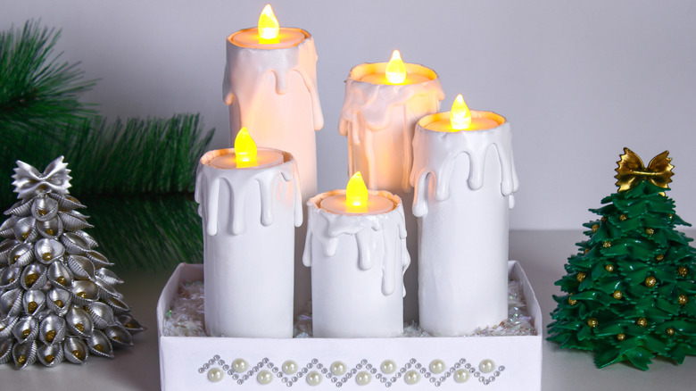 five fake candles made with toilet paper rolls and tea lights