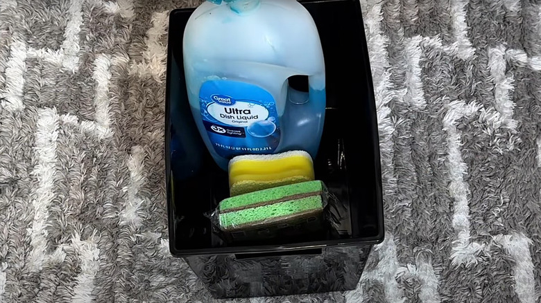 Undersink kitchen supplies in Dollar Tree plastic bin