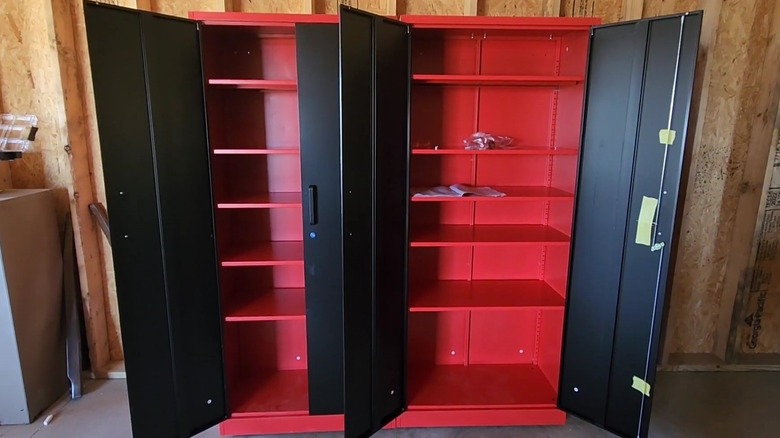 Man at metal cabinet in garage