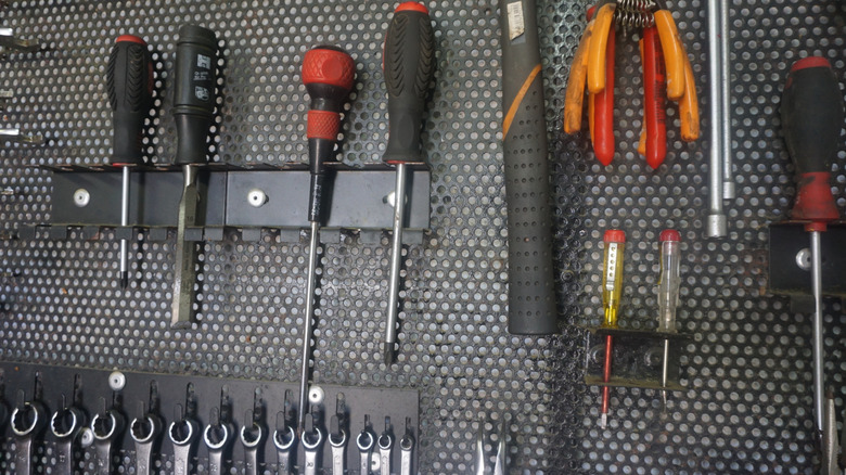 metal pegboard with tools
