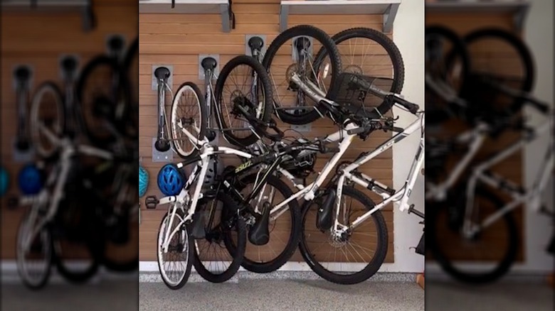 bikes mounted on garage wall with bike rack