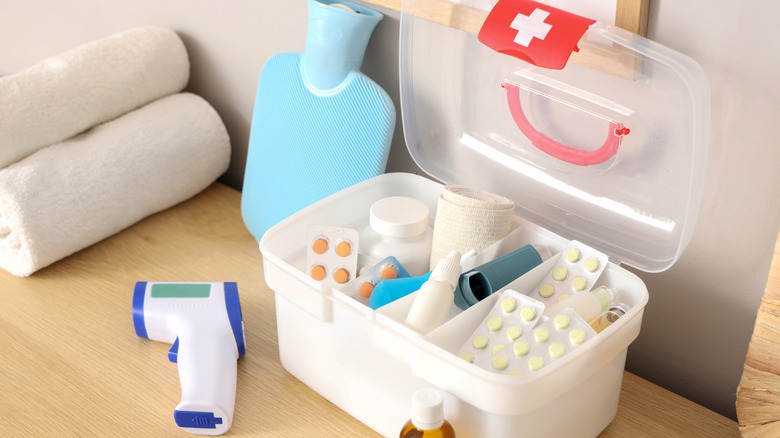 First aid kit in box sitting on a shelf