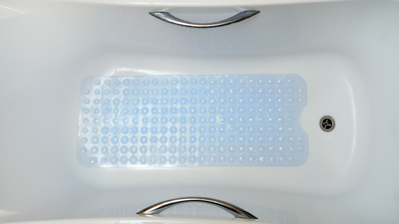 Blue non-slip mat inside bathtub
