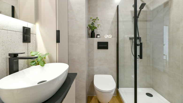 Modern neutral bathroom with all black matte features