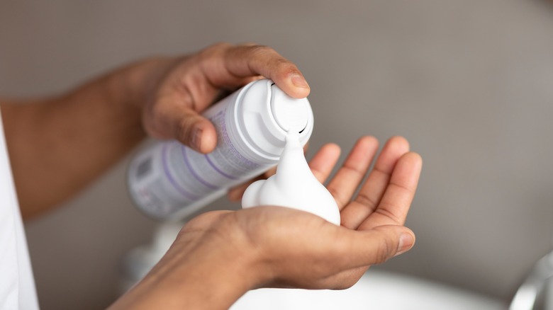 spraying bottle of shaving cream